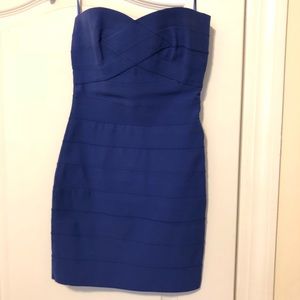 Royal blue strapless bandage dress.